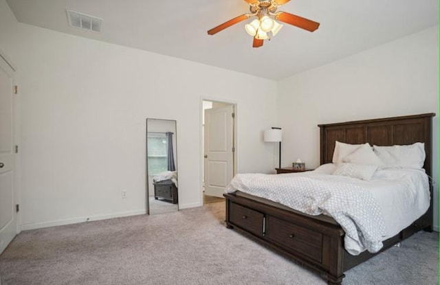 bedroom with light colored carpet and ceiling fan