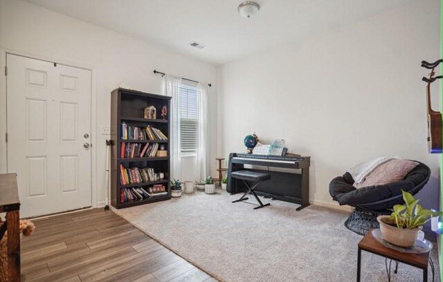 living area with hardwood / wood-style floors