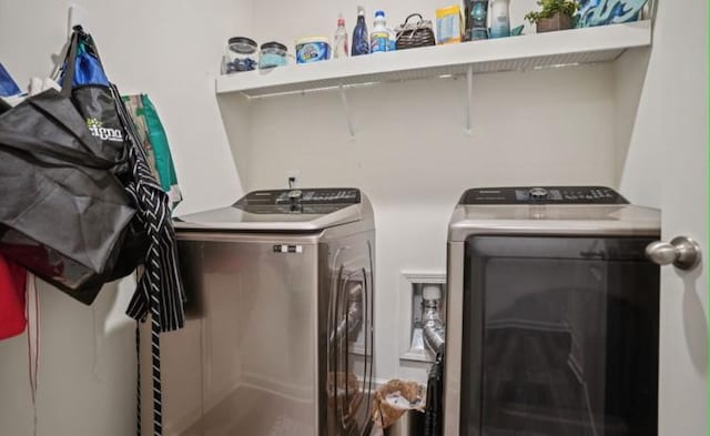 laundry area with washer and clothes dryer