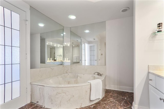 full bathroom featuring baseboards, marble finish floor, a garden tub, vanity, and recessed lighting