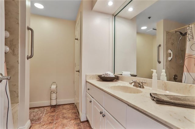 full bath featuring a shower, recessed lighting, vanity, and baseboards