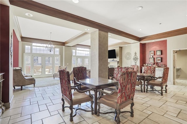 dining area with ornamental molding, french doors, a chandelier, and stone tile floors