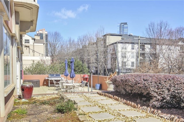 exterior space with fence and a patio