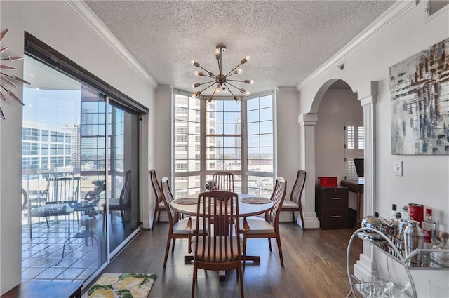 dining area with visible vents, arched walkways, dark wood-type flooring, and crown molding