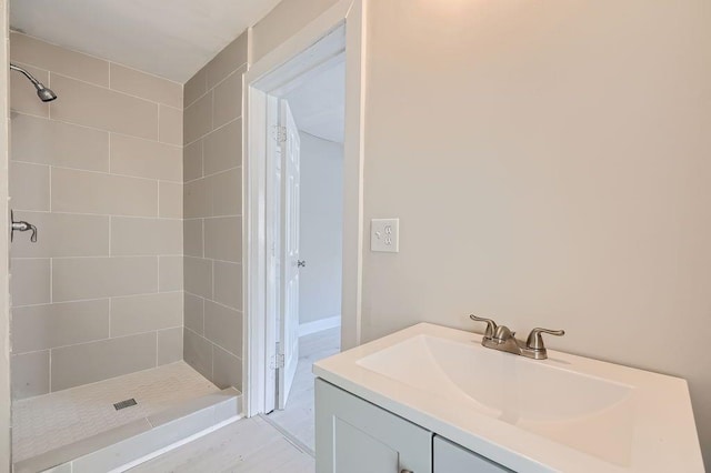 bathroom featuring vanity and a shower stall