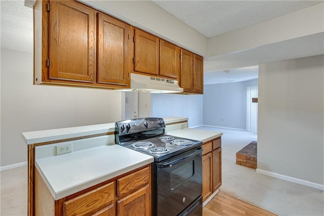 kitchen with a textured ceiling and black / electric stove