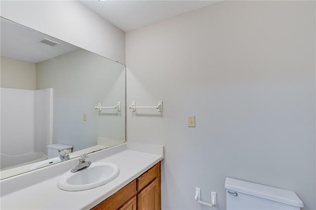 bathroom with vanity and toilet