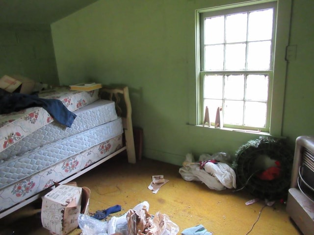 bedroom featuring heating unit