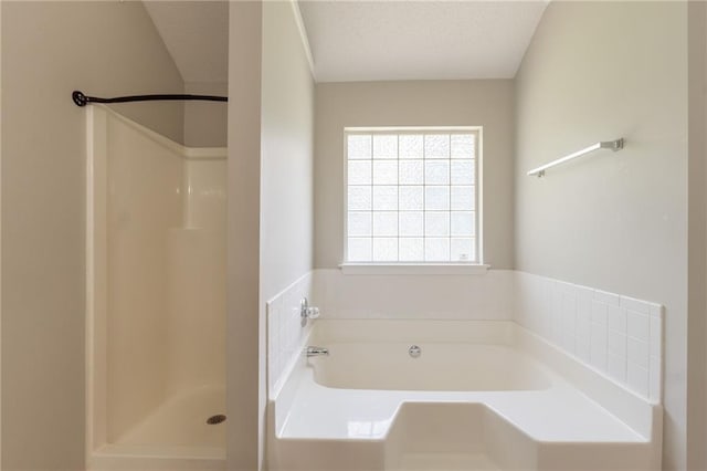 full bath with a shower stall and a garden tub
