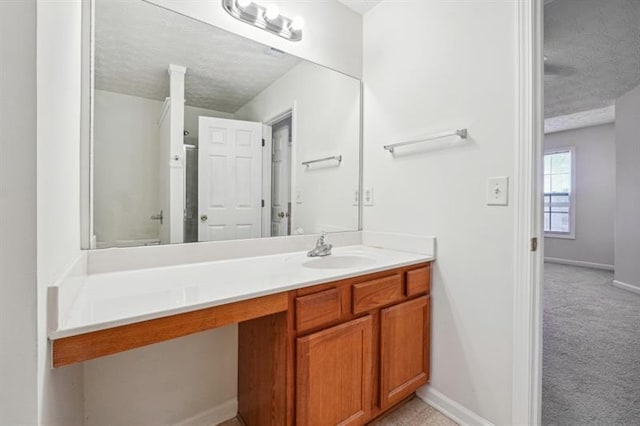 bathroom featuring vanity and a textured ceiling