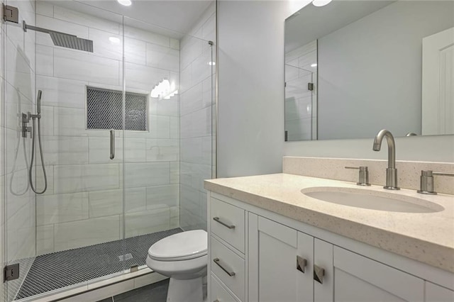 bathroom featuring vanity, toilet, an enclosed shower, and a baseboard heating unit