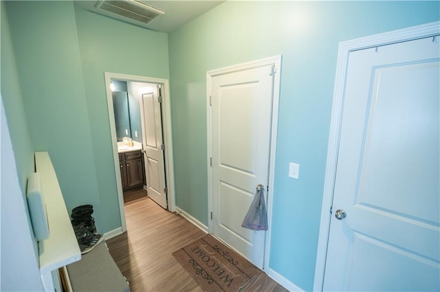 corridor featuring light hardwood / wood-style floors