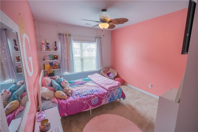 bedroom with ceiling fan and light colored carpet