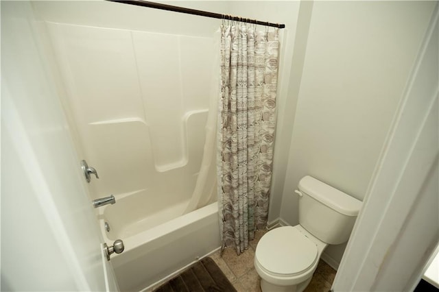 bathroom with toilet and shower / bath combination with curtain