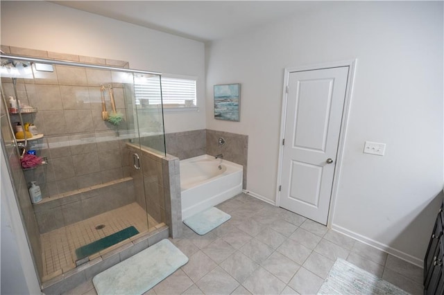 bathroom with tile patterned flooring and shower with separate bathtub