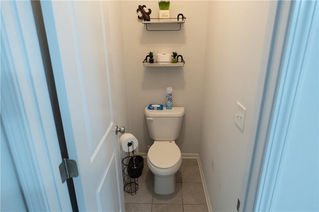 bathroom featuring toilet and tile patterned floors