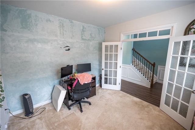 office space with french doors and light carpet