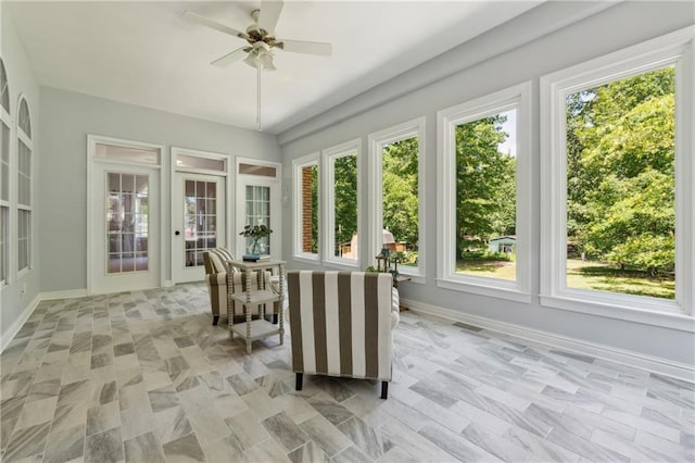 sunroom with ceiling fan