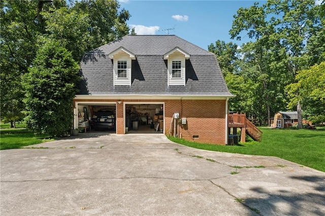 view of side of property with cooling unit, a garage, a yard, and a deck