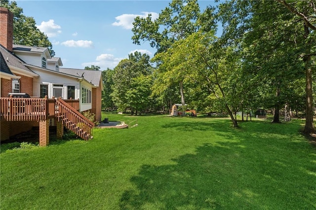 view of yard featuring a deck