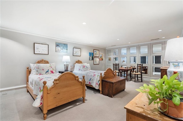 2525 Peachtree Rd Unit 28, Atlanta, GA 30305 - bedroom with light carpet, recessed lighting, and crown molding
