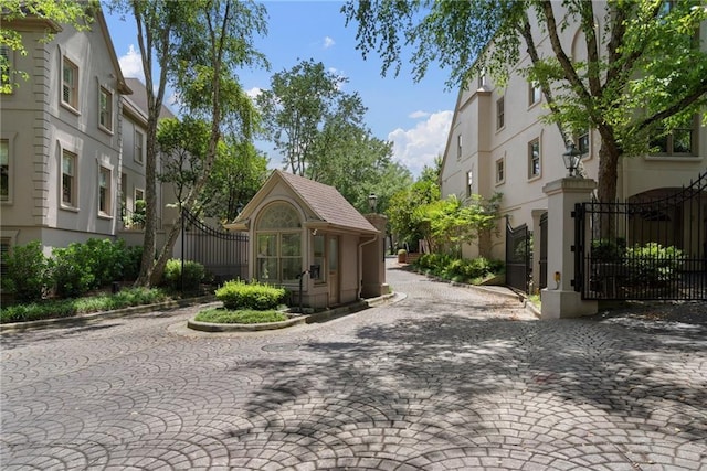 2525 Peachtree Rd Unit 28, Atlanta, GA 30305 - view of street featuring a gate, curbs, and street lighting