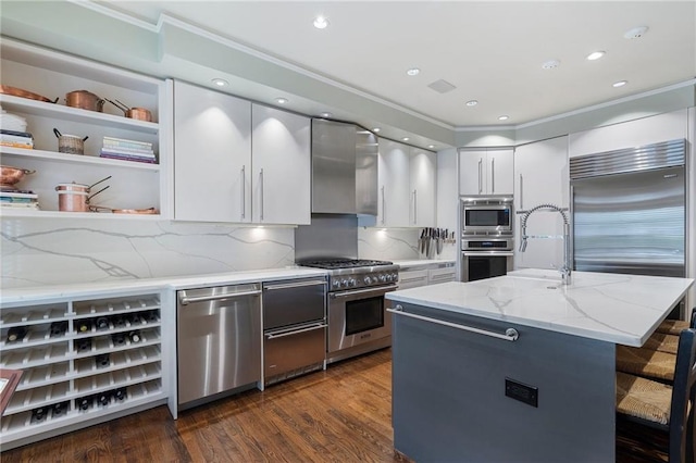 2525 Peachtree Rd Unit 28, Atlanta, GA 30305 - kitchen featuring built in appliances, white cabinetry, modern cabinets, dark wood-style flooring, and ornamental molding