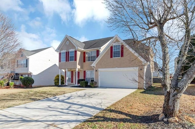 view of front of house with a garage and a front lawn