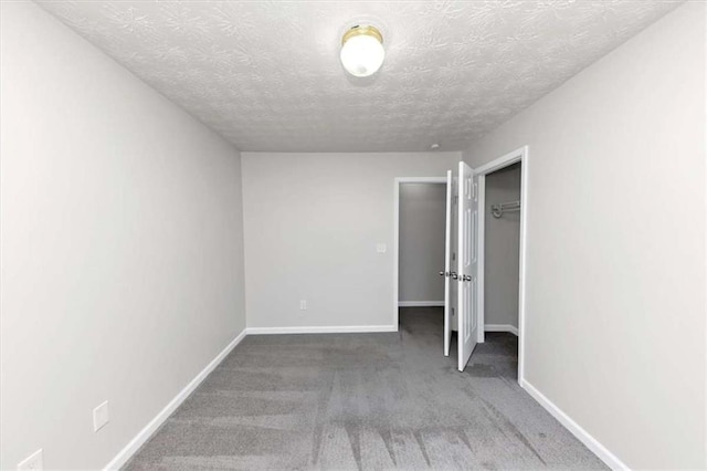 508 Cascade Walk, Mcdonough, GA 30253 - unfurnished bedroom with carpet flooring and a textured ceiling