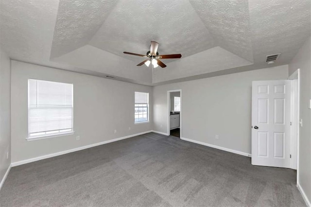508 Cascade Walk, Mcdonough, GA 30253 - carpeted spare room featuring ceiling fan, a raised ceiling, and a textured ceiling