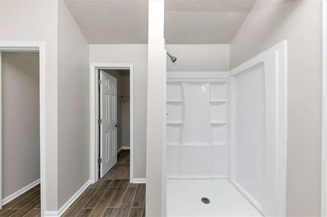508 Cascade Walk, Mcdonough, GA 30253 - bathroom with a textured ceiling and walk in shower