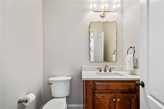 half bath with vanity and toilet