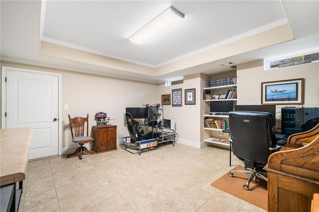 office area featuring a tray ceiling, baseboards, and crown molding