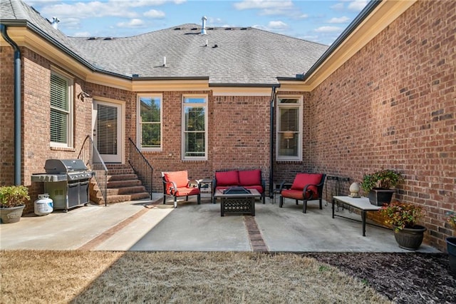 view of patio featuring grilling area, an outdoor living space with a fire pit, and entry steps