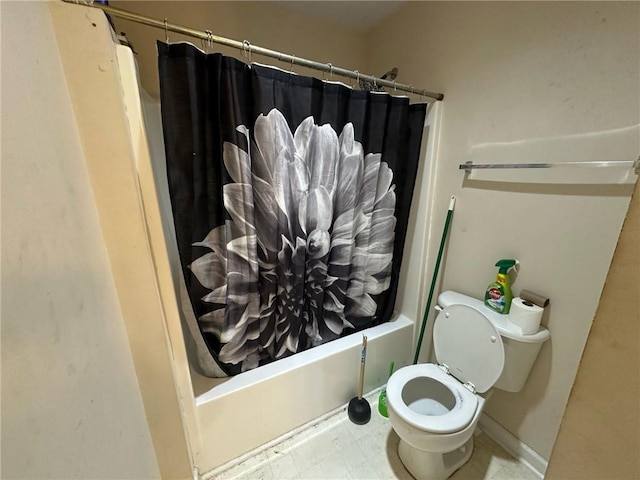 bathroom with shower / tub combo and toilet