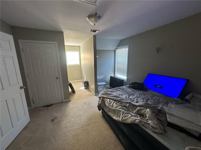 bedroom with light colored carpet