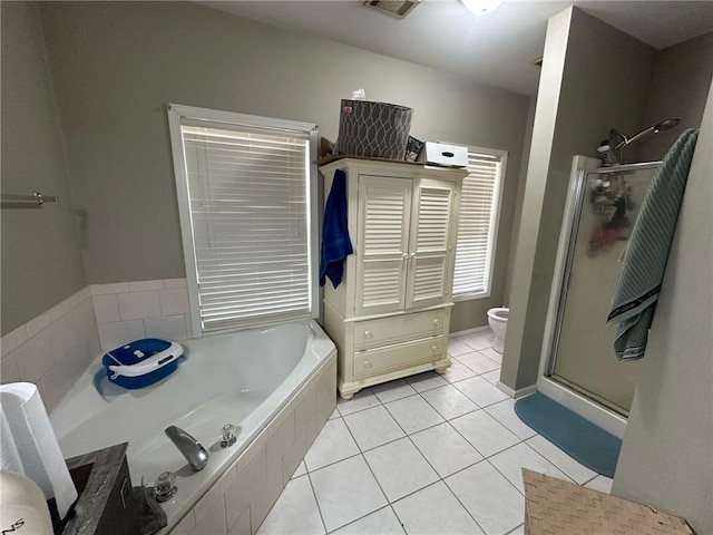 bathroom with tile patterned flooring, plus walk in shower, and toilet