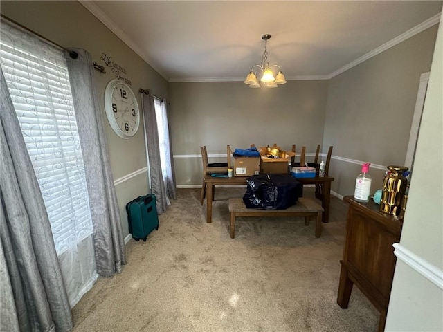 dining area with an inviting chandelier, crown molding, and light carpet