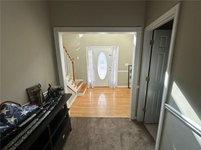 foyer featuring carpet flooring