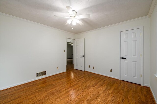 4324 Japonica Ct SW, Lilburn, GA 30047 - spare room featuring wood finished floors, ceiling fan, and crown molding