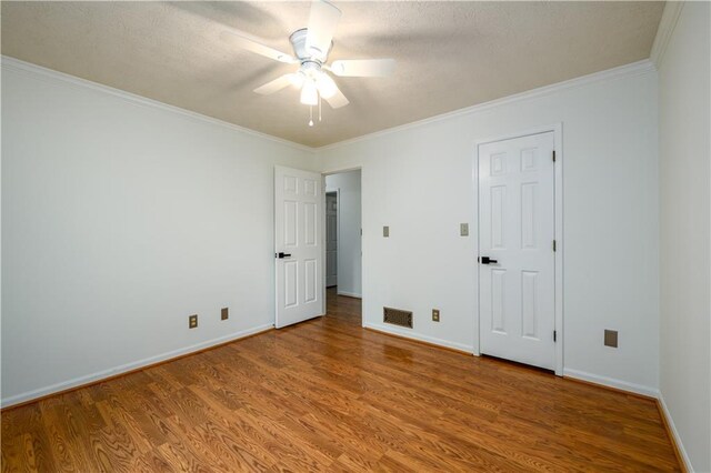 4324 Japonica Ct SW, Lilburn, GA 30047 - unfurnished room featuring wood finished floors, a ceiling fan, crown molding, and a textured ceiling