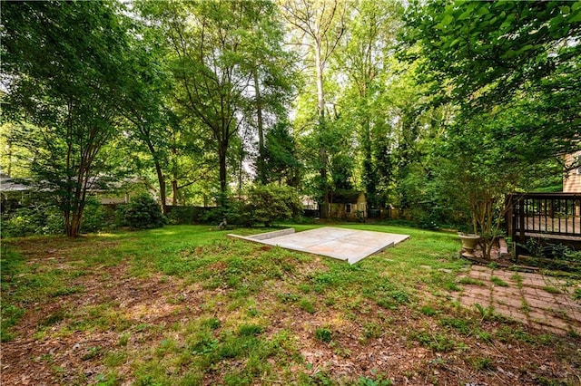 4324 Japonica Ct SW, Lilburn, GA 30047 - view of grassy yard featuring an outbuilding and a deck