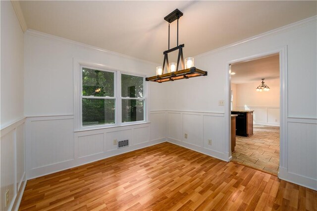 4324 Japonica Ct SW, Lilburn, GA 30047 - spare room featuring light wood finished floors, ceiling fan, and crown molding