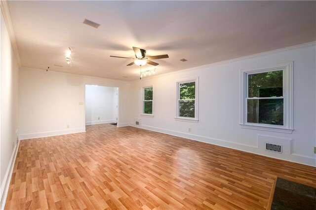 4324 Japonica Ct SW, Lilburn, GA 30047 - unfurnished dining area featuring a chandelier, a decorative wall, ornamental molding, light wood finished floors, and wainscoting