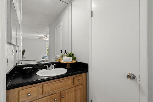 bathroom with vanity and ceiling fan