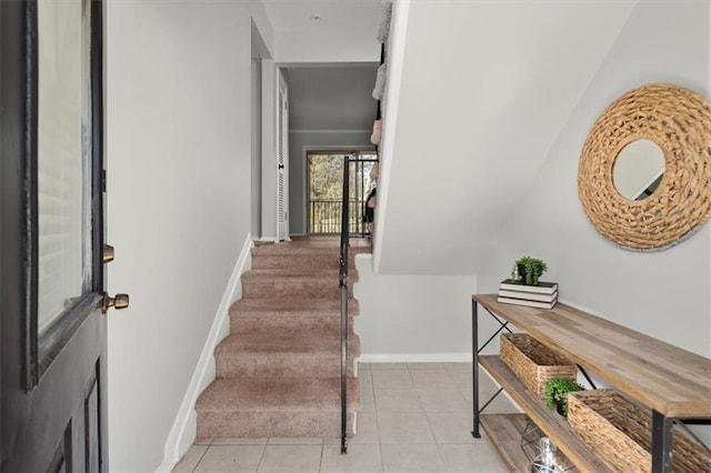 stairs with tile patterned floors