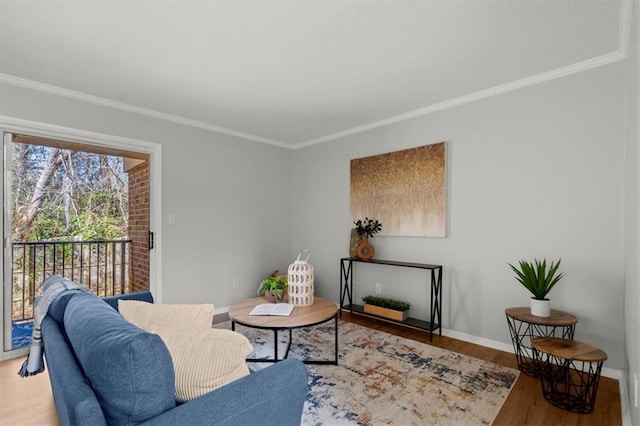 living room with crown molding and hardwood / wood-style floors