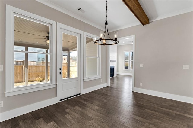 interior space featuring a large fireplace, visible vents, baseboards, dark wood finished floors, and beam ceiling