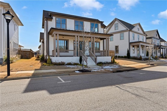 view of front facade with a residential view and a porch