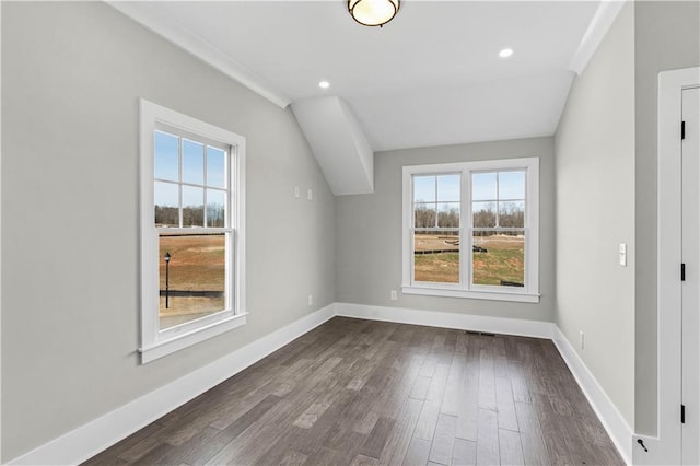 bonus room with dark wood-style floors, recessed lighting, lofted ceiling, and baseboards